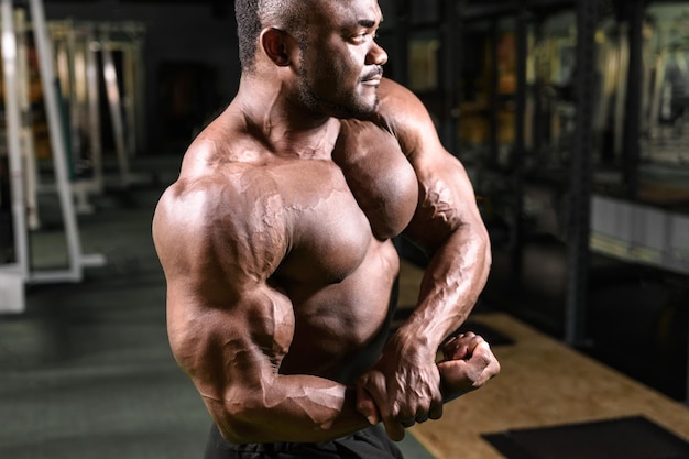 African bodybuilder posing in the gym