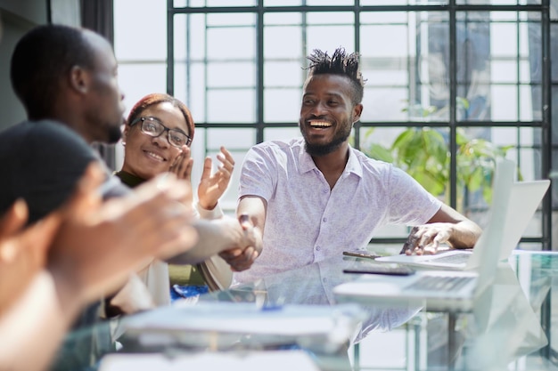 African business people handshake at modern office