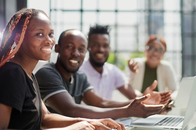 African businessman with group of businesspeople