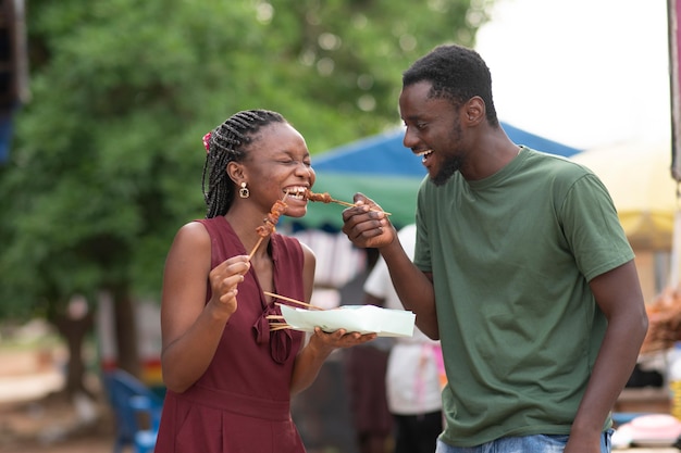 African couple eating street food