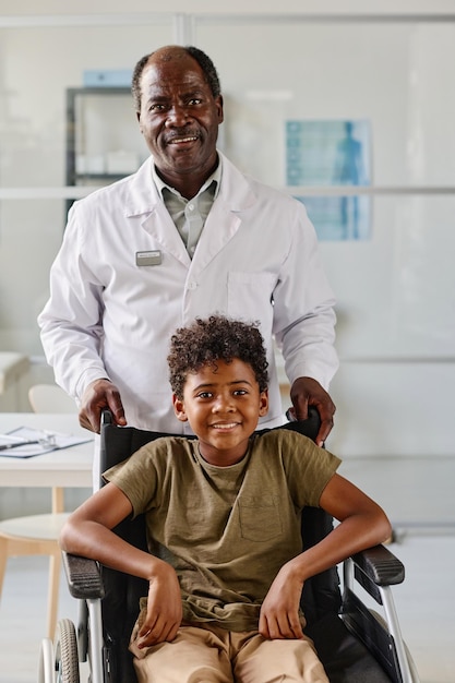 African doctor with patient with disability at hospital