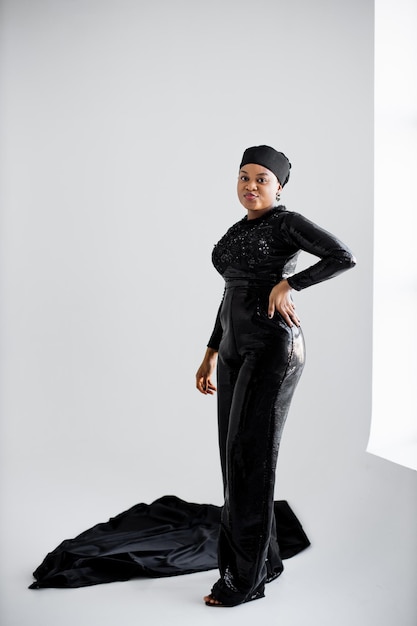 African islamic woman in elegant black clothes posing in studio