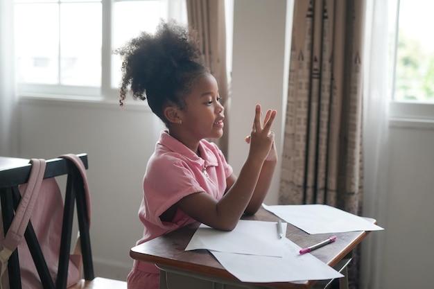 African kids drawing and do homework in classroom young girl happy funny study at school