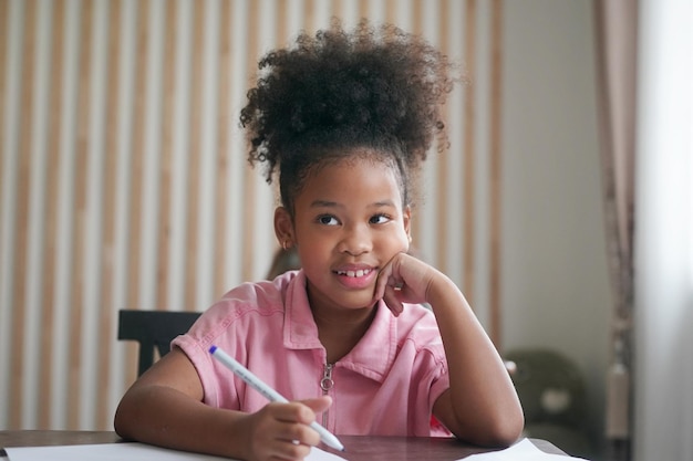 African kids drawing and do homework in classroom young girl happy funny study at school