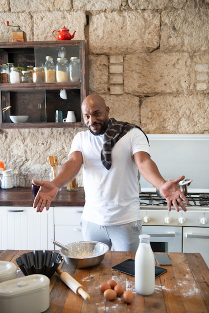 african man in the kitchen of his house