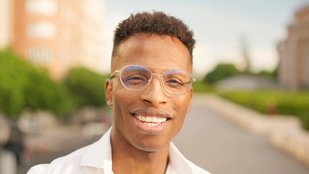 African man looks at camera and smiles