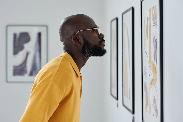 African man visiting art gallery