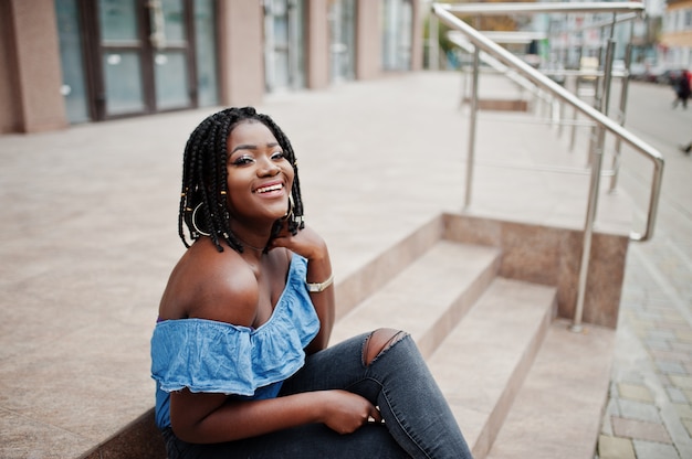 African stylish woman posing outside