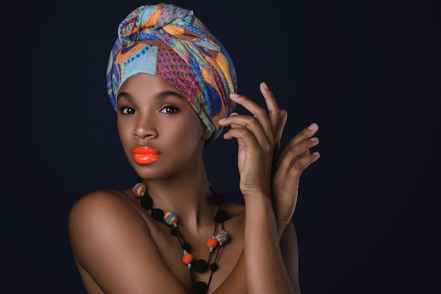 African woman with a colorful shawl on her head