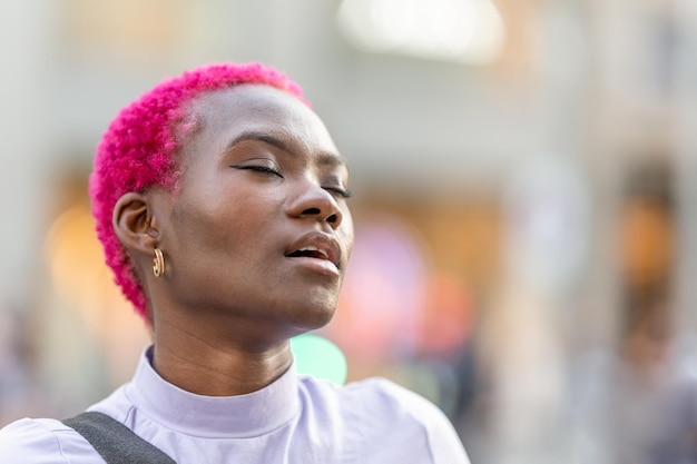 African woman with a face of pleasure in the street