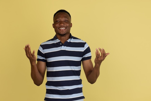 African young male portrait isolated over studio background with copyspace