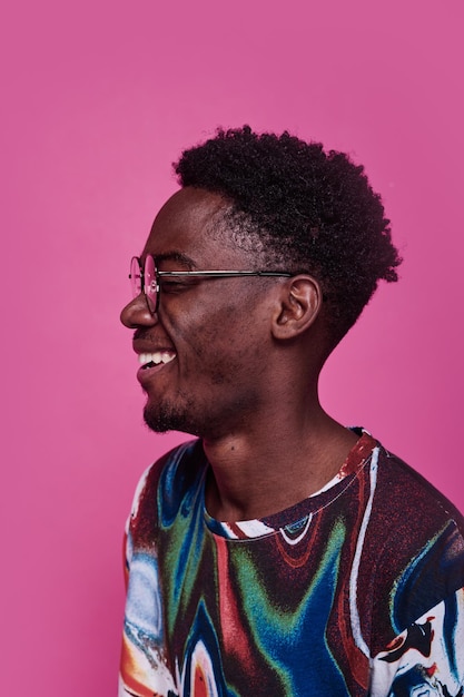 African young man in eyeglasses laughing