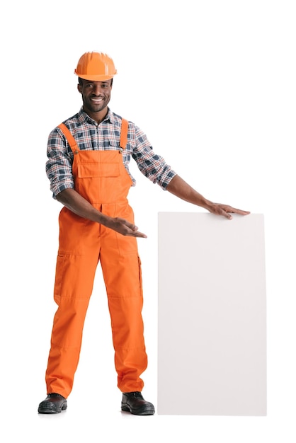 Africanamerican builder with blank white banner isolated on white