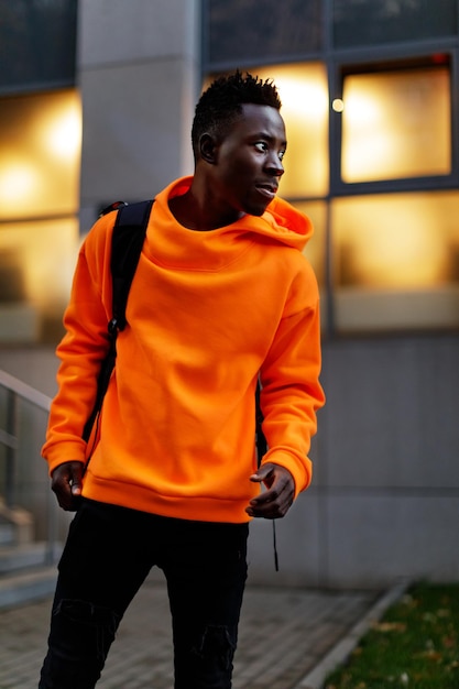 Africanamerican man in stylish orange hoodie