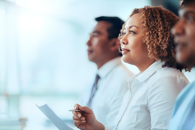 AfricanAmerican mature businesswoman student sitting learning listening in education training