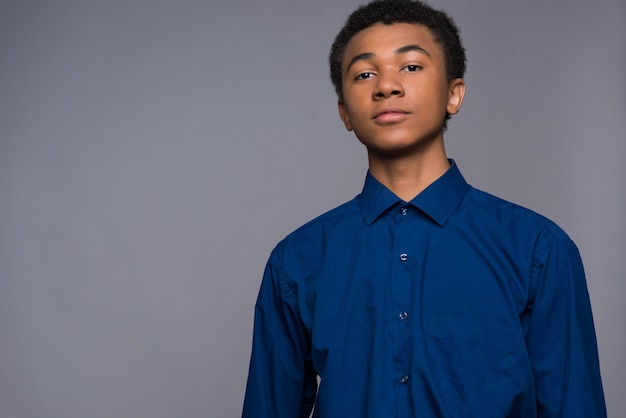 Afro American Boy With Curly Hair. Camera Stare.