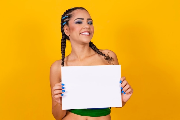 Afro brazilian woman cheerleader holding a blank sign with free space for text