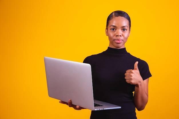 Afro business woman working online with laptop computer.