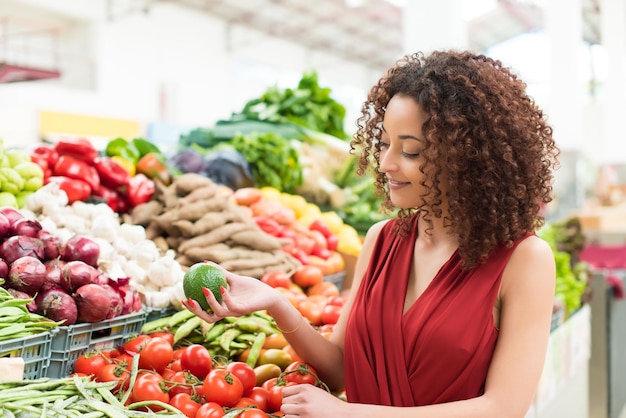 Afro woman shopping organic veggies and fruits