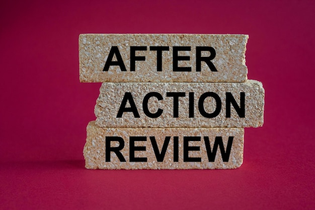 Photo after action review symbol concept words aar after action review on brick blocks red background