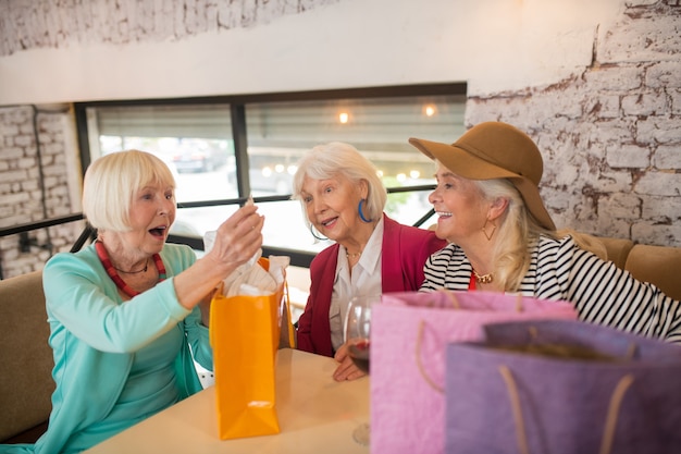 Photo after shopping. senior cheerful senior females feeling good after shopping