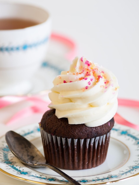 Afternoon tea served with a white cupcake.