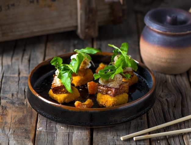 AGEDASHI TOFU salad served in a dish isolated on wooden background side view of salad