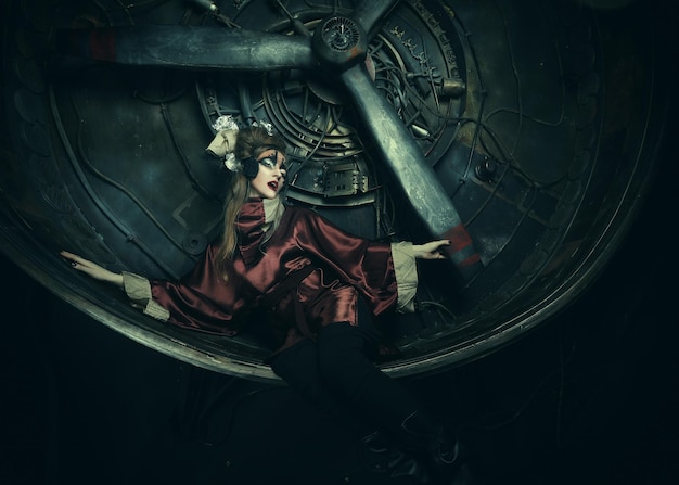 Aggressive stylish steampunk lady in a creative interior Art an fashion concept