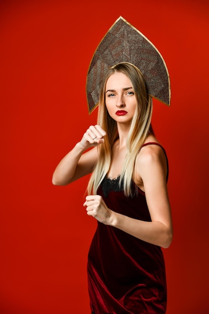 Aggressive woman boxing Expression emotion and feelings concept Studio shot