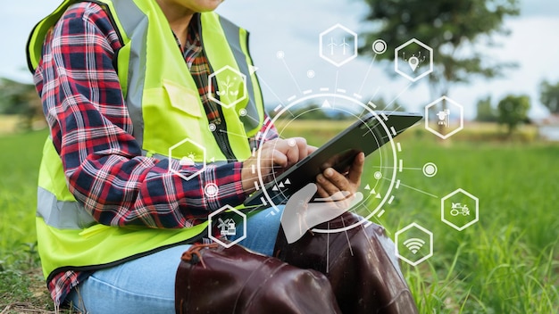 Agriculture technology farmer woman holding tablet or tablet technology to research about agriculture problems analysis data and visual icon