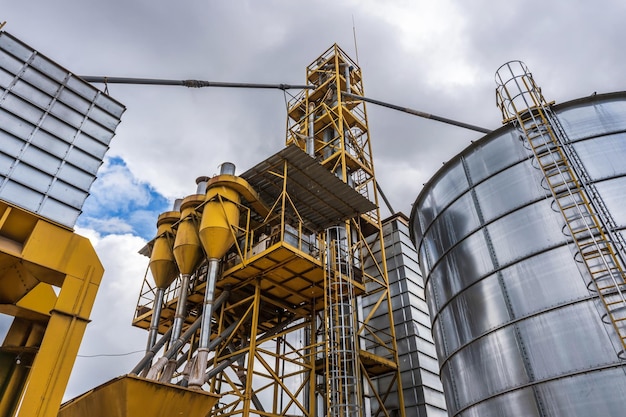 Agro silos granary elevator with seeds cleaning line on agroprocessing manufacturing plant for processing drying cleaning and storage of agricultural products