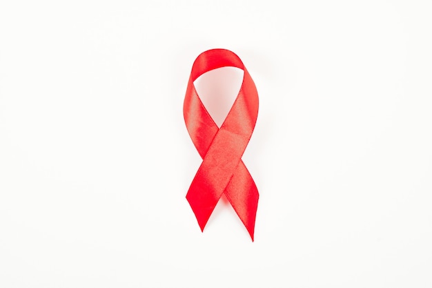 Aids awareness red ribbon isolated on white background