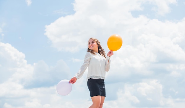 Air balloons for party Cheerful girl have fun Summer holidays and vacation Childhood happiness Joyful teen celebrate Play with air Happiness is simple Happiness concept Freedom concept