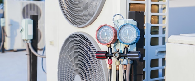 Air conditioner technician checking air conditioner operation.