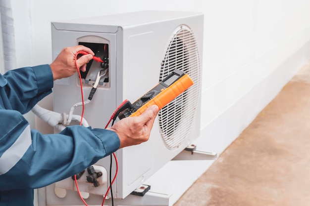 Air conditioning technician checks the operation of the air conditioner.