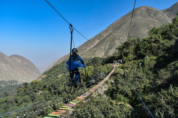 AIR AND EXTREME BICYCLE Skybike woman on a bicycle that is suspended and secured by steel rope