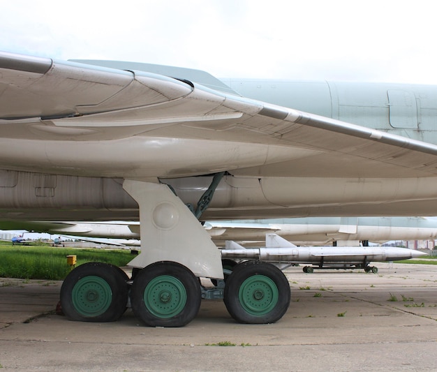 Air-launched missiles under the wing of a landed bomber at military air base