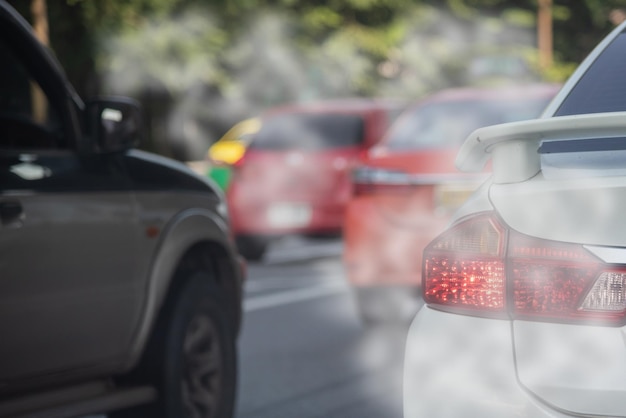 Air pollution from car exhaust smoke traffic in the city Reducing global warming pollution and carbon dioxide from engine combustion