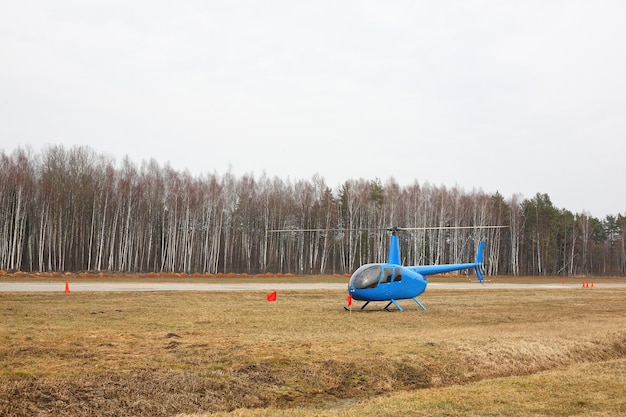 Aircraft Small blue helicopter parking