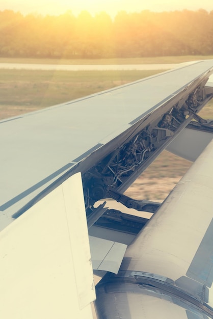 Aircraft Wing Airplane ready for takeoff at the morning