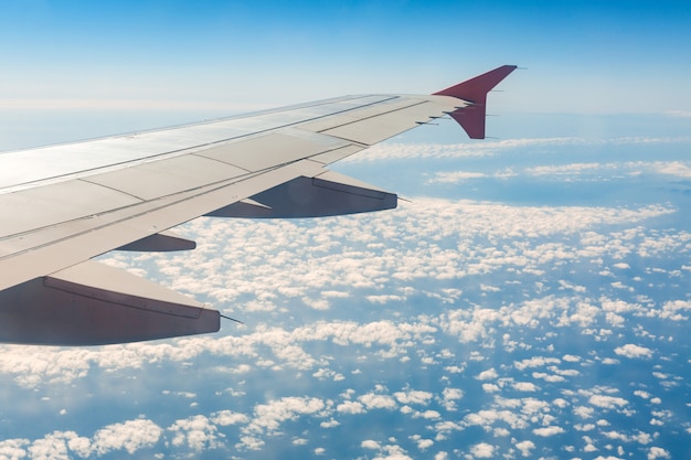 Aircraft wing on the clouds