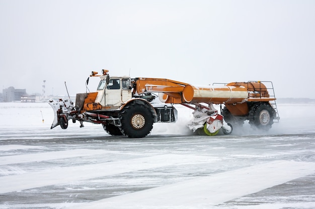 Airfield sweeper cleans the Runway