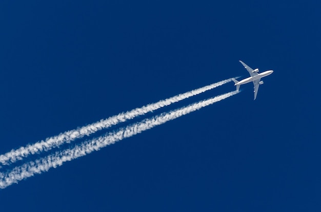 Airplane big four engines aviation airport contrail clouds.