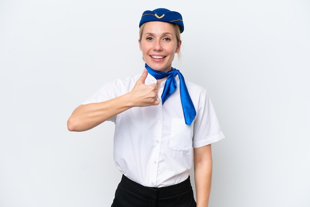 Airplane blonde stewardess woman isolated on white background giving a thumbs up gesture