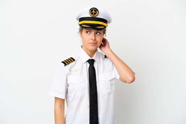 Airplane blonde woman pilot isolated on white background having doubts