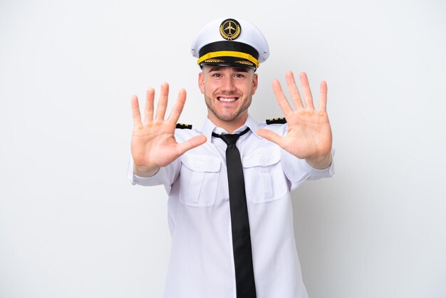 Airplane caucasian pilot isolated on white background counting ten with fingers