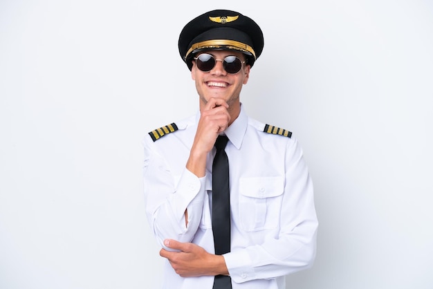 Airplane caucasian pilot isolated on white background with glasses and smiling