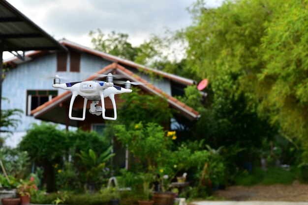 Airplane drone take off from land and flying for take aerial photo front of home