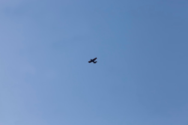 airplane flying in the blue sky