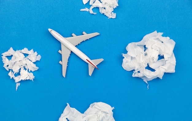 Airplane model with paper ball Instead of white clouds on blue background